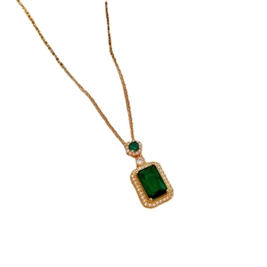 Elegant gold titanium necklace with emerald green gemstone square pendant and micro-pave diamonds