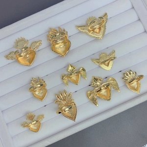 Vintage gold adjustable heart rings featuring Gothic wings and flame designs in white tray
