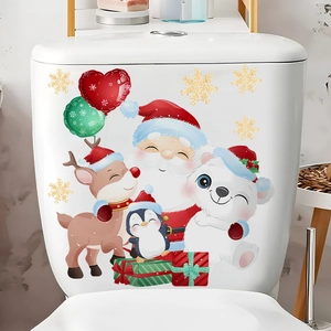 Close-up of Santa and reindeer Christmas decals on a white bathroom toilet tank