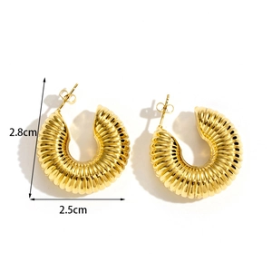 Golden chunky C-shaped hoop earrings with textured vertical ridges and butterfly backs