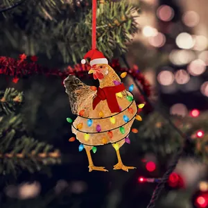 Detailed view of acrylic chicken pendant with Christmas hat and scarf on a tree