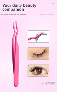 Close-up of pink stainless steel eyelash applicator showing its curved ergonomic design