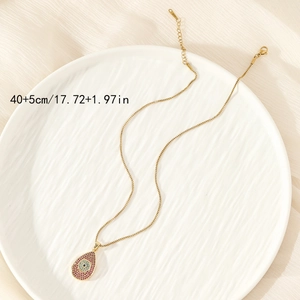 Golden box chain necklace with evil eye teardrop pendant and colorful zircon crystals