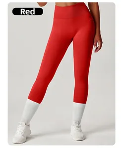 Close-up of high-waisted red yoga pants featuring hidden side pockets and wide waistband