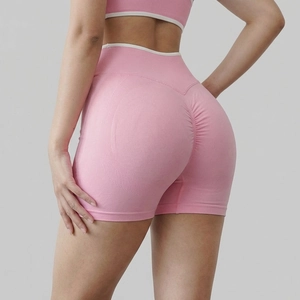 Detail view of pink seamless high-waist shorts featuring scrunch butt and rib textures