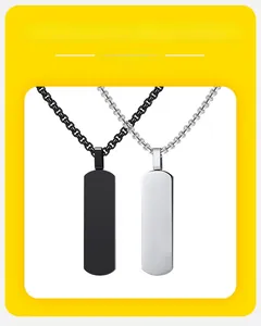 Macro shot of silver and black matte rectangular geometric pendant necklaces with box chains