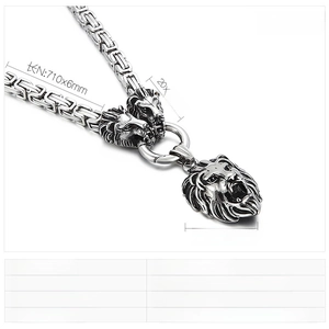 Detail of masculine shield lion pendant with heavy Byzantine steel chain necklace
