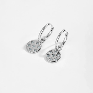 Macro detail of S925 sterling silver hoop earrings with inlaid light blue zircons