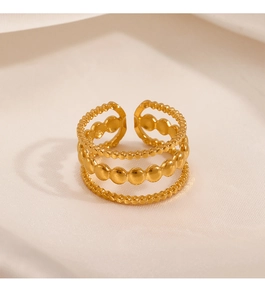 Detail of three-layer beaded gold stainless steel ring with adjustable open design
