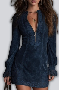 Detail of V-neck embroidery and front zipper on long sleeve dark blue dress