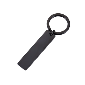 Minimalist black rectangular stainless steel keychain with a matte finish on white background