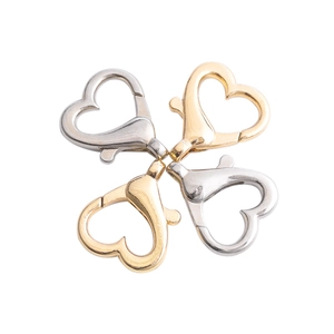 Golden and silver heart-shaped lobster clasps for DIY jewelry making in symmetric layout