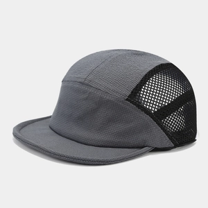 Detail of grey 5-panel camping cap showing breathable mesh panels and ripstop fabric texture