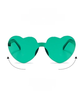 Detail of green heart-shaped rimless sunglasses featuring clear lenses and trendy design