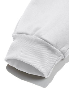Detailed macro view of white ribbed cuff texture on heavy fleece sweatpants