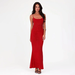 Close-up detail of the elegant red rhinestone evening dress with textured sequin fabric