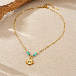 Retro 14K gold-plated stainless steel necklace with sun evil eye pendant and turquoise beads