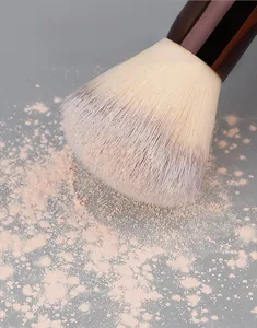 Detail of soft synthetic bristles showing strong powder pickup for smooth makeup