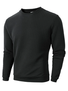 Close-up of black waffle-knit texture on long-sleeve crewneck sweatshirt for men