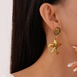 Vintage gold starfish drop earrings with textured metal finish for women in retro style