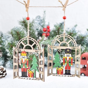 Christmas wooden nutcracker soldier pendants hanging on a festive blurred tree