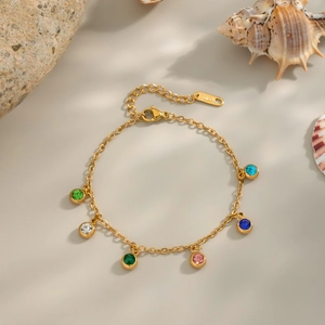 Detail of 18K gold plated stainless steel bracelet with multi-colored zircon stones