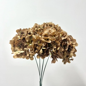 Close-up of artificial brown hydrangea bouquet with detailed silk petals and green stems