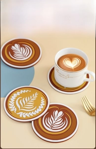 Detailed view of heat-resistant PVC round coasters with latte art patterns in warm tones