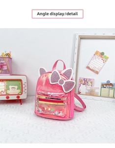 Detail of pink sequin cat ear backpack with colorful glitter filled front pocket