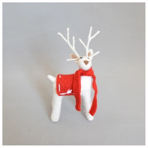 Close-up of handmade wool felt reindeer with red scarf and snowflake embroidery