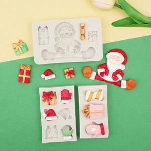 Detailed view of Christmas themed silicone molds featuring Santa and gift box shapes