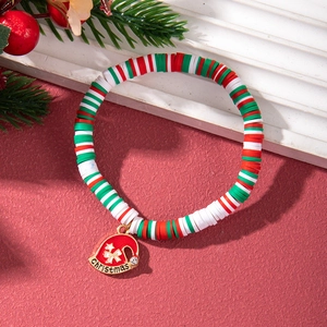 Detail of Christmas beaded bracelet with clay discs and Santa hat charm with rhinestones