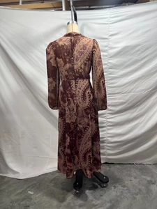 Rear view of a bohemian paisley chiffon maxi dress showing high waist A-line fit