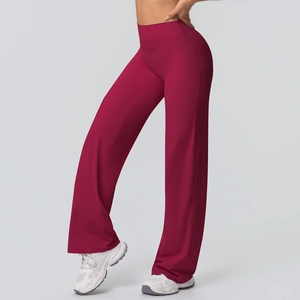 Detailed side view of high-waisted wide-leg yoga pants in deep red brushed fabric
