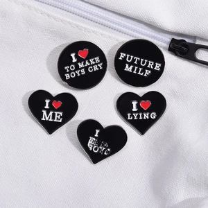 Set of 5 black enamel badges with heart and round shapes on white canvas fabric