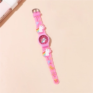 Detail of pink children's watch featuring 3D unicorn and star patterns on silicone strap