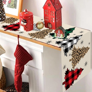 Beige Christmas table runner with plaid and leopard print trees on a festive mantel