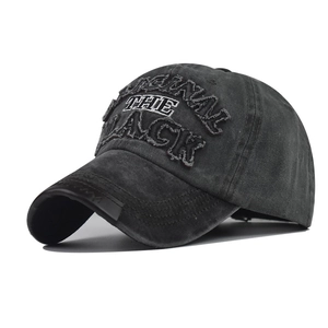 Macro side view of vintage washed grey cotton baseball cap with BLACK 3D embroidery