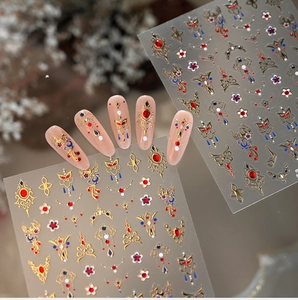 Detail showing vintage golden embroidery nail stickers with floral and butterfly patterns