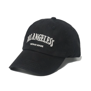 Black washed canvas baseball cap with white Los Angeles embroidery and curved brim