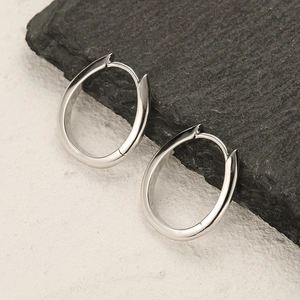 Minimalist S925 sterling silver geometric oval hoop earrings on textured stone base