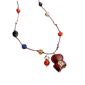 Retro ethnic style necklace with dark wood pig pendant and colorful glass beads