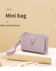 Detail of light purple litchi grain leather mini coin purse with removable wristlet