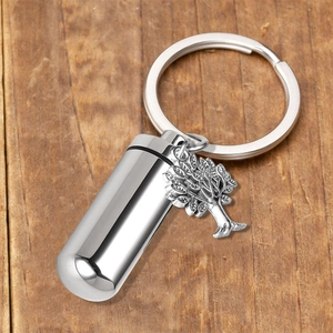 Stainless steel cremation urn keychain with cylinder pendant and silver tree of life charm