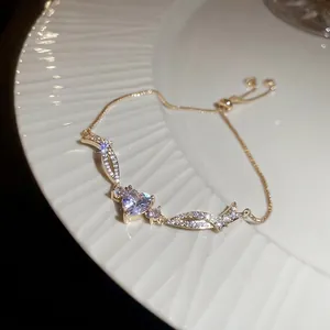 Elegant gold adjustable heart bracelet with sparkling cubic zirconia center stone