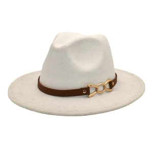 Detail of white wool fedora hat featuring brown leather band and gold chain buckle