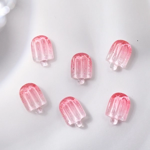Detailed view of six pink transparent glitter resin ice cream nail art charms