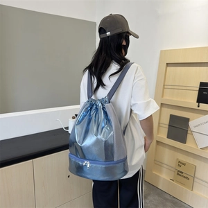 Metallic blue drawstring backpack with wet-dry separation and breathable mesh side panels
