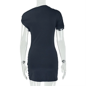 Rear view of tight black mini dress featuring side ruching and knitted fabric details