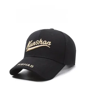 Detailed close-up of golden 3D embroidery on black cotton twill baseball cap